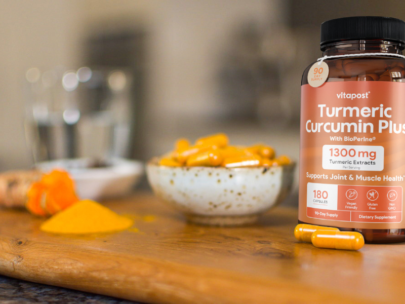 A bottle of Turmeric Curcumin Plus with capsules, the subject of this review.